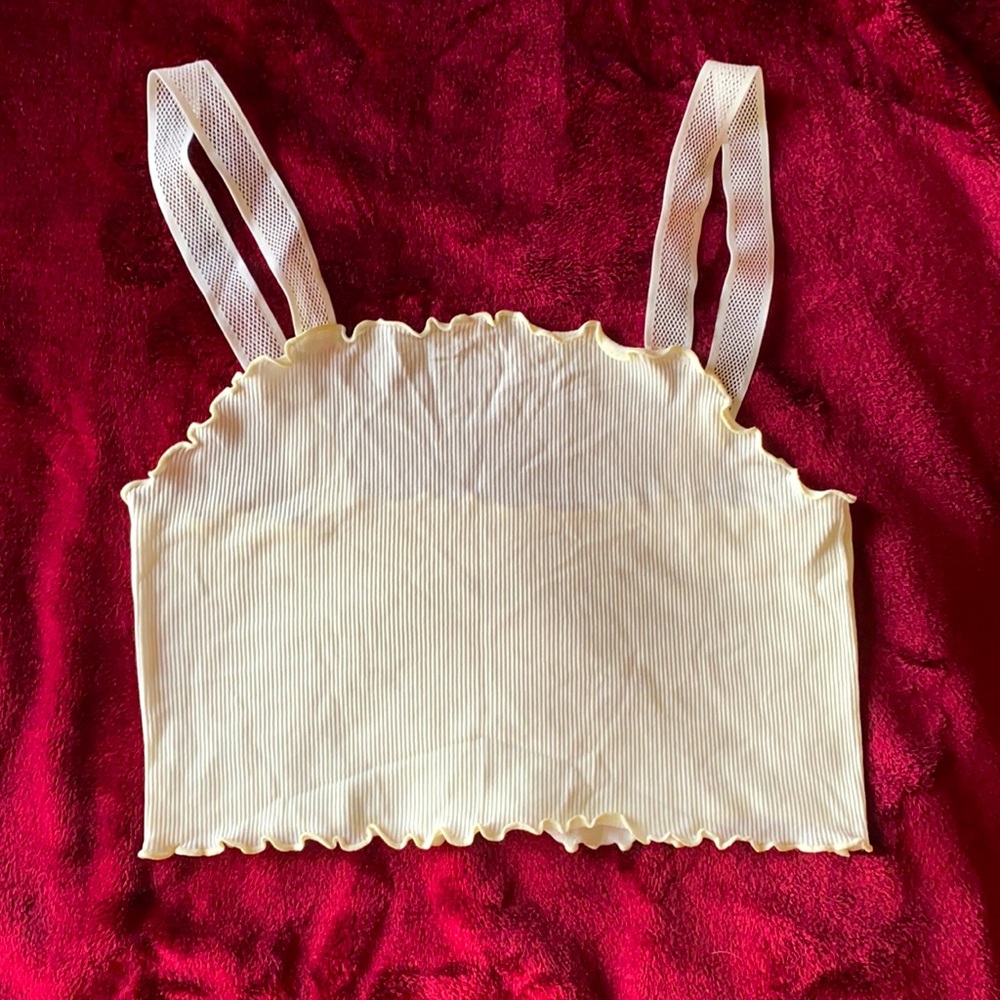 Off White crop top. stretchy material with mesh see through straps